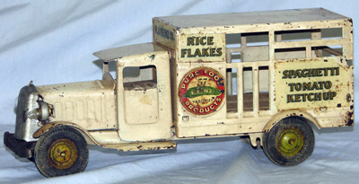 Kenton Jaeger cement mixer; Wilkens cast iron paddle wheeler; Arcade Fageol bus; Metalcraft vintage Heinz delivery truck.