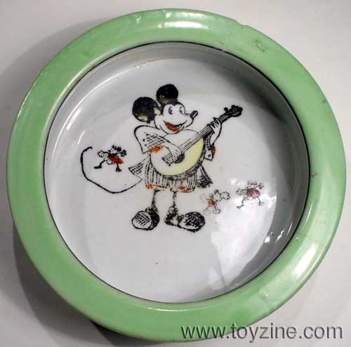 MICKEY MOUSE BOWL - 1930s, a luster lime green rim circle a pie eyed Mickey and friends as he plays a tune